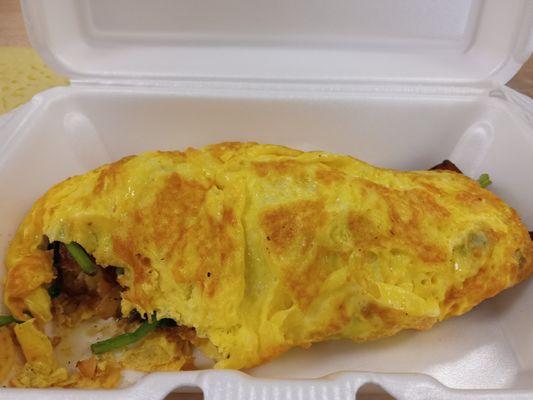 Omelette customized with no cheese and 3 toppings of onion, potatoes, and spinach.