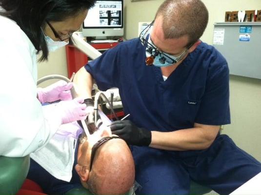 Dr. Arnold Berger working on Dr. Paul Berger.  True family dentistry!