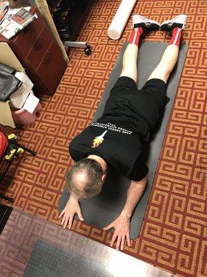 An upper back and shoulder repositioning exercise.