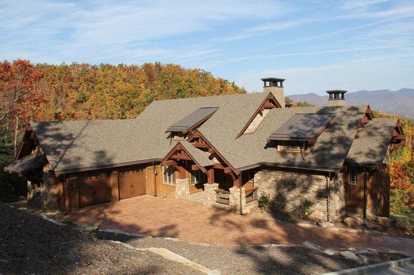 New CertainTeed Landmark Weathered Wood architectural shingle and Englert Dark Bronze standing seam metal roof system by DLV Roofing.