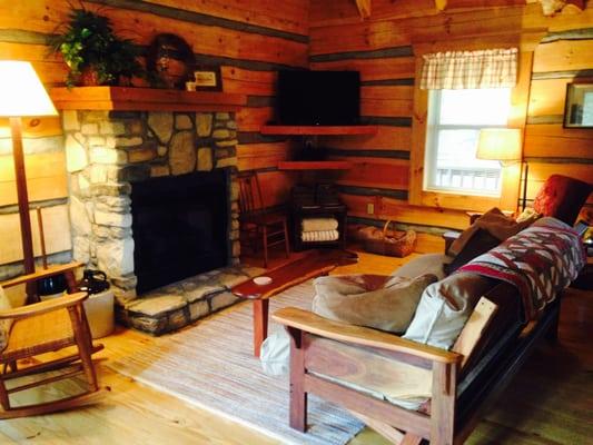 Living room with fireplace, futon, HDTV