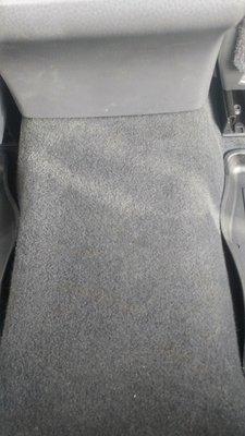 Large hole in automotive carpeting repaired