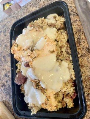 Stuffed smoked turkey bowl with dirty rice and salmon with cream assu