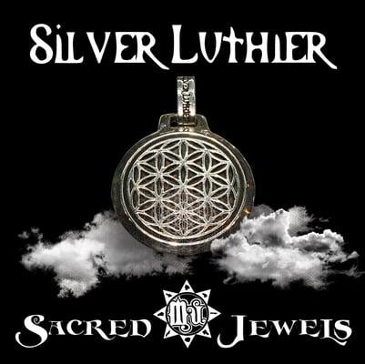 "Flower of Life" pendant by Silver Luthier available at Sacred Jewels of Mu. Stop by for a complimentary beverage.