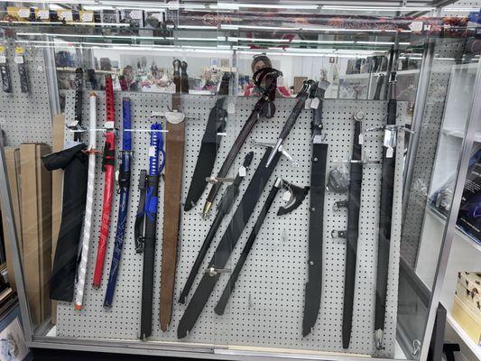 Knights and Samurai swords, knives, and axes for sale.