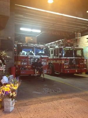 Firemen at work and flowers out front for 9/11 respect