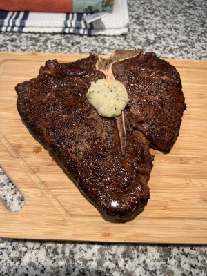 24 oz Porterhouse with homemade garlic butter, cooked medium rare.