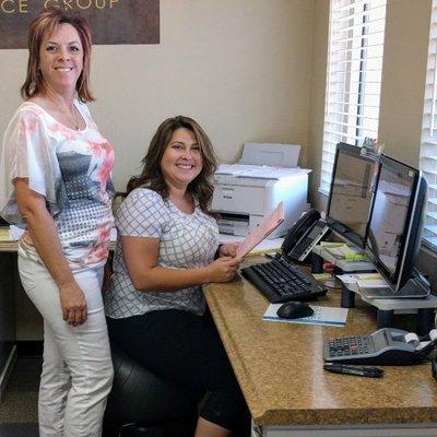 Amber and Sandy hard at work in the office!