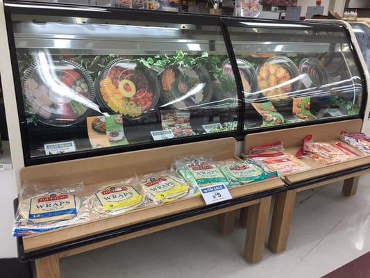 Look at the selection of meat/cheese/veggie/fruit trays! So fresh (cardboard)