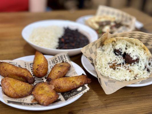 Maduros, pabellon arepa, and black beans and rice