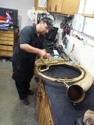 Here is Scott working on my Sousaphone. He has all of the tools and equipment necessary for the job.