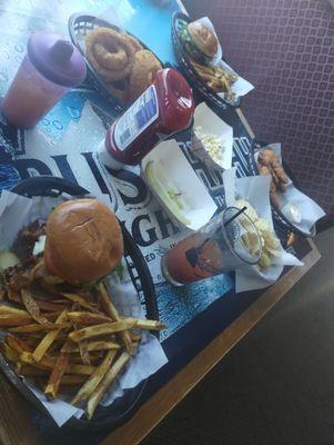 Bacon cheeseburger with fries. Side of onion rings. Bloody Mary, chicken tenders with potato chips.