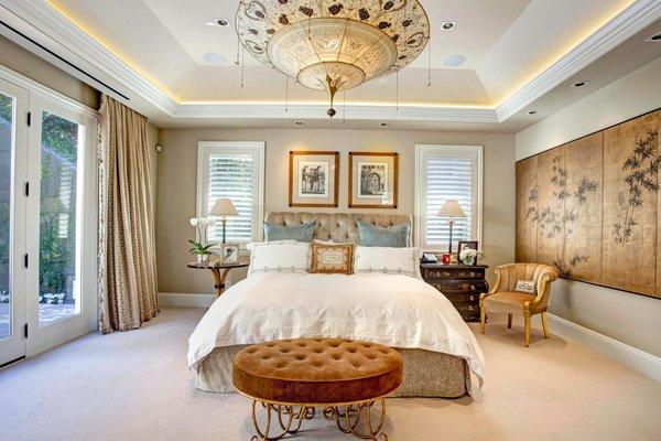 Bright and luxurious Master Bedroom built as an Add-On in 5 months.  Tray ceilings with cove lighting. Fortuny  Chandelier and Silk drapes.