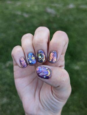 Gel manicure with nail art and sticker art/charms