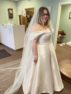 This is a Wedding Gown that I was able to add a panel on the side and change the shoulder as well as the hem