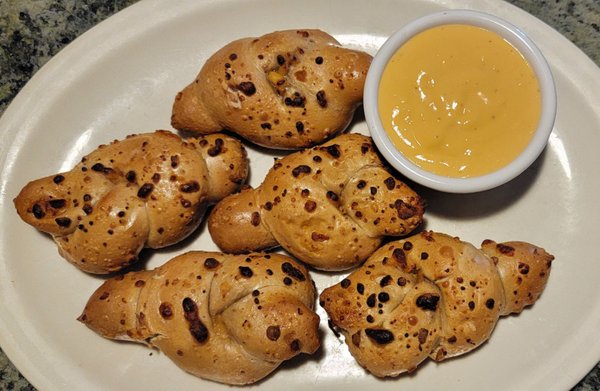 Stuffed pretzel knots; pretzel knots stuffed with pimento cheese, served with beer cheese for dipping!