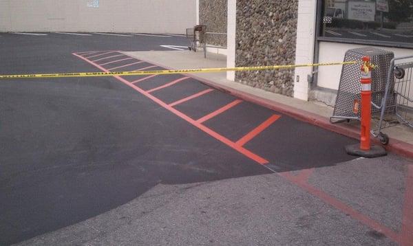 The difference between an old parking lot in need of seal, and a parking lot sealed and striped by Boyds Asphalt Services