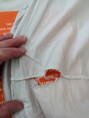 The orange area demonstrates where the rip in the seam is!  This apparently wasn't enough to justify a free exchange