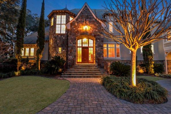 Front door of pristine property in golf community