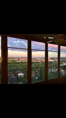 summer view from enclosed balconies with ceiling fan