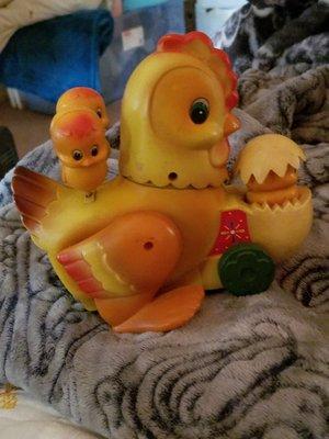 Battery operated antique hen with baby chicks