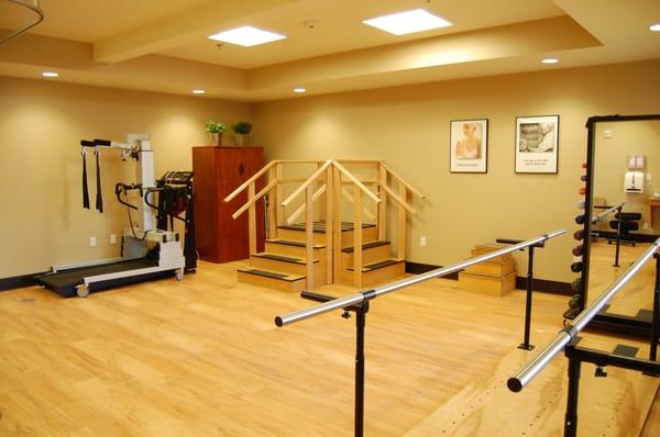 Spacious, modern physical therapy gym.