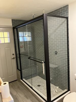 Custom Semi-Frameless Shower - Sliding Doors with Panel on seat - Matte Black Hardware, Clear Glass