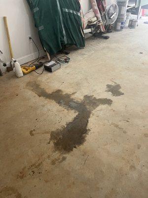 The mess that Jiffy Lubes bad oil job left on my garage floor.