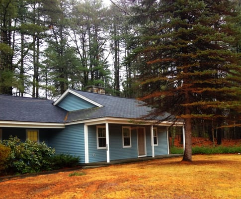 My office is in this blue building.  Located on Rt 122 in Amherst. Turn at the Currier Lumber sign.