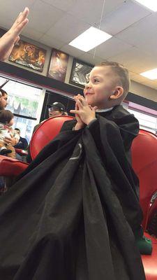 His face when he got to see his haircut