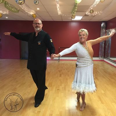 Amateur dancesport couple prepares to compete with Boston Ballroom at a local dancesport competition.