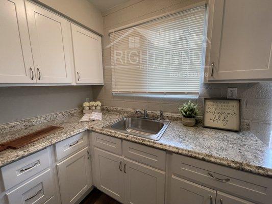 Fresh Kitchen Remodel. New Cabinets, Vinyl countertops.