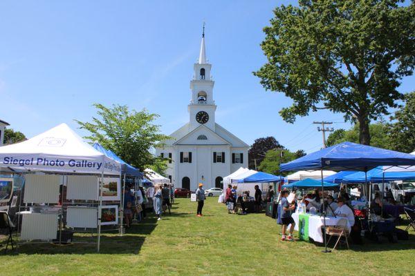 The market is situated on a beautiful grassy green.