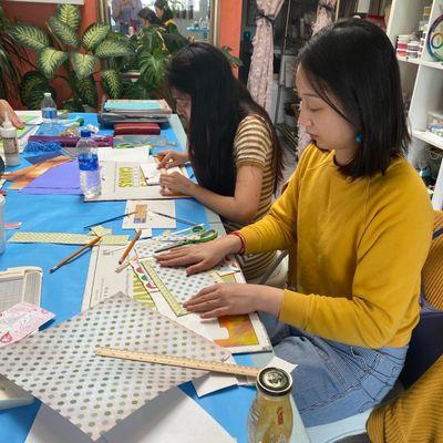 Students at a Japanese Stab Binding Workshop make their own journals by hand.