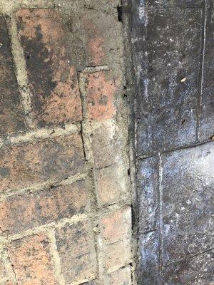 No seam between concrete and brick