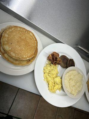 Mudsugars Sampler; this includes 2 strips of bacon, pork sausage, eggs, pancakes and grits