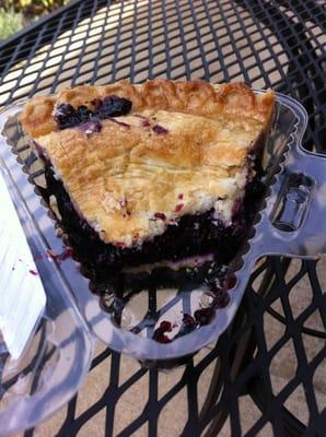 Enjoying a breezy out door lunch. Had Italian Wedding soup and as u can see $2 slice of blueberry. YUMMY