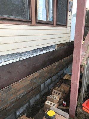 Replacing siding for brick