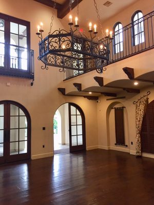 Interior of event space looking back at arched entry door.