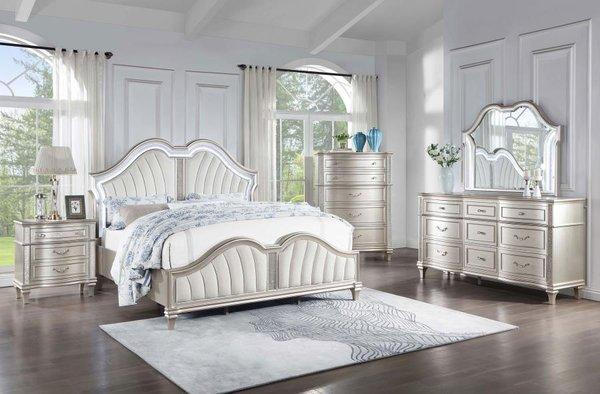 This elegant, glam bedroom set boasts a beautiful double arch platform bed and matching three-drawer nightstand, nine-drawer dresser, vanity