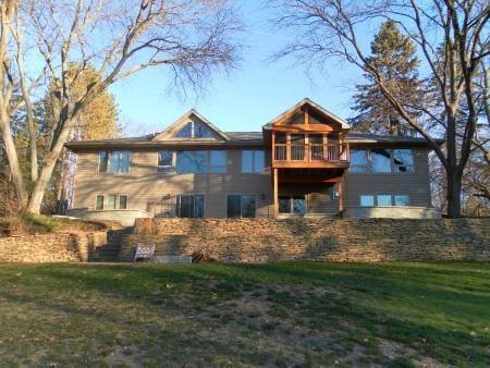 This is an after picture of a home we remodeled and added onto.  We built a beautiful screened in porch over looking the rive...