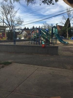 Playground with monkey bars and lots of sand