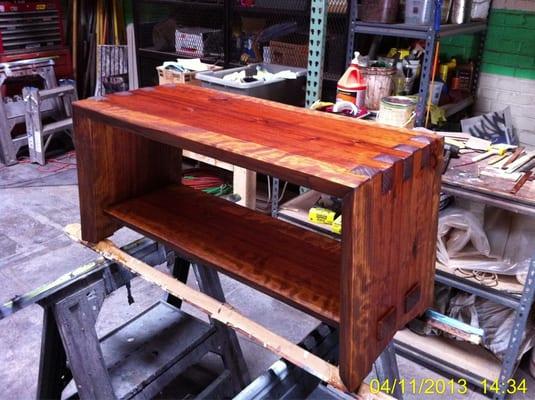 Urban redwood office bench. Hand cut finger joinery and through tenons on the bottom stretcher.