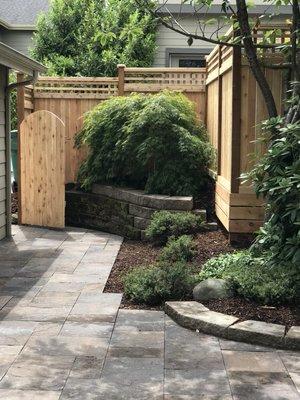 Columbia slate paver patio with a cedar fence with a one foot lattice.