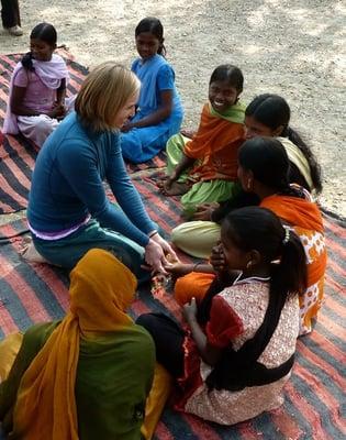 Sunny teaching hand massage as part of the ZIA PROJECT in Bodhgaya, India