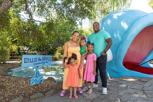 Willie the Whale spouts water from his blowhole and invites visitors to climb into his belly.