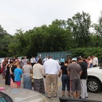 Praying in the parking lot together during the fire 2014