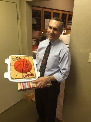 Celebrating Dr. Thompson's birthday with a fantastic cake creation by Amber!