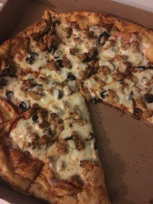 Deluxe pizza with green pepper, black olives, sausage, onion and mushroom.