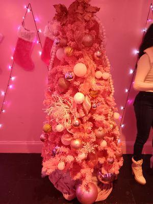 A beautifully decorated pink Christmas tree